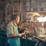 photo of man standing inside his workshop